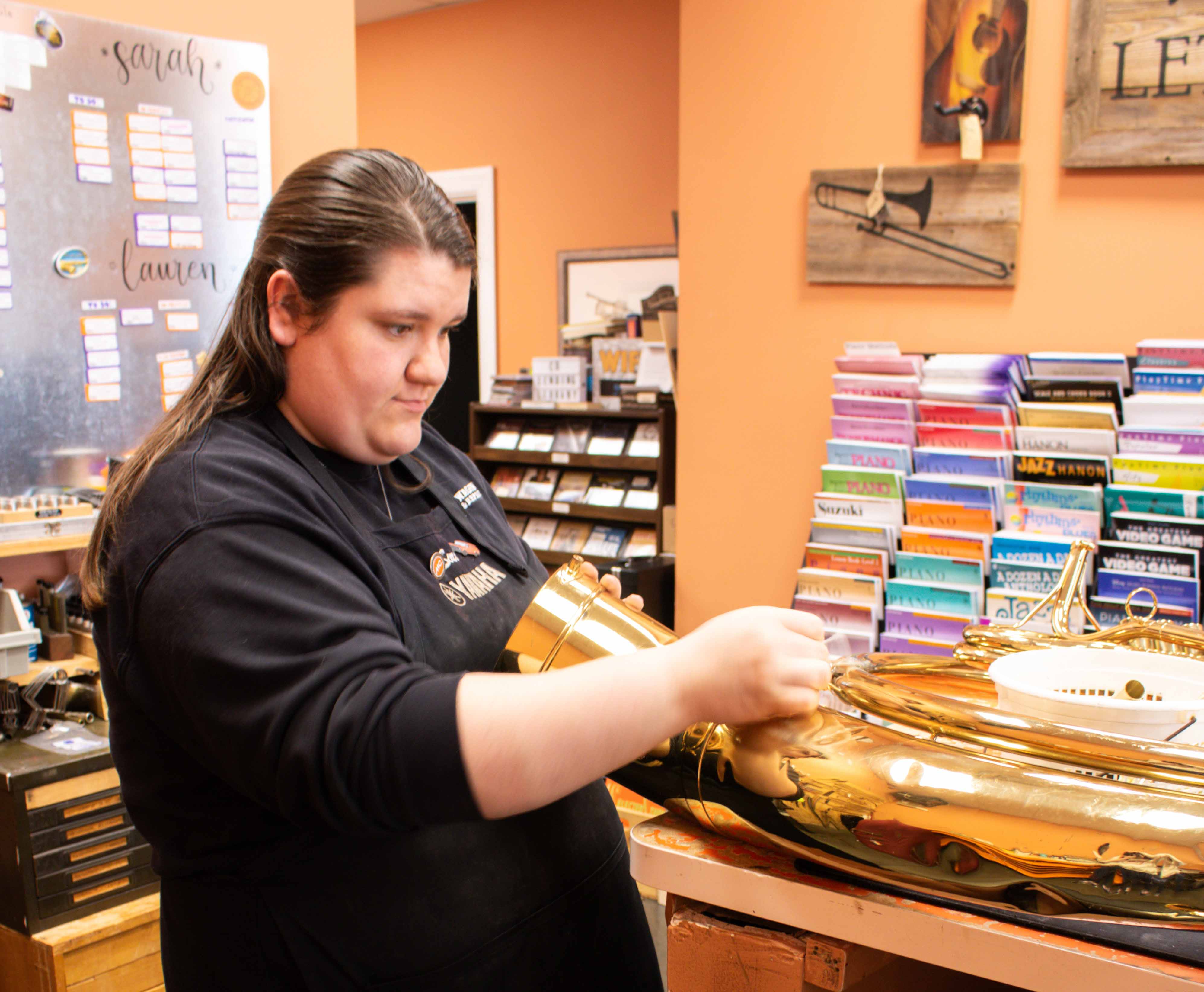 Sarah Repairing a Tuba