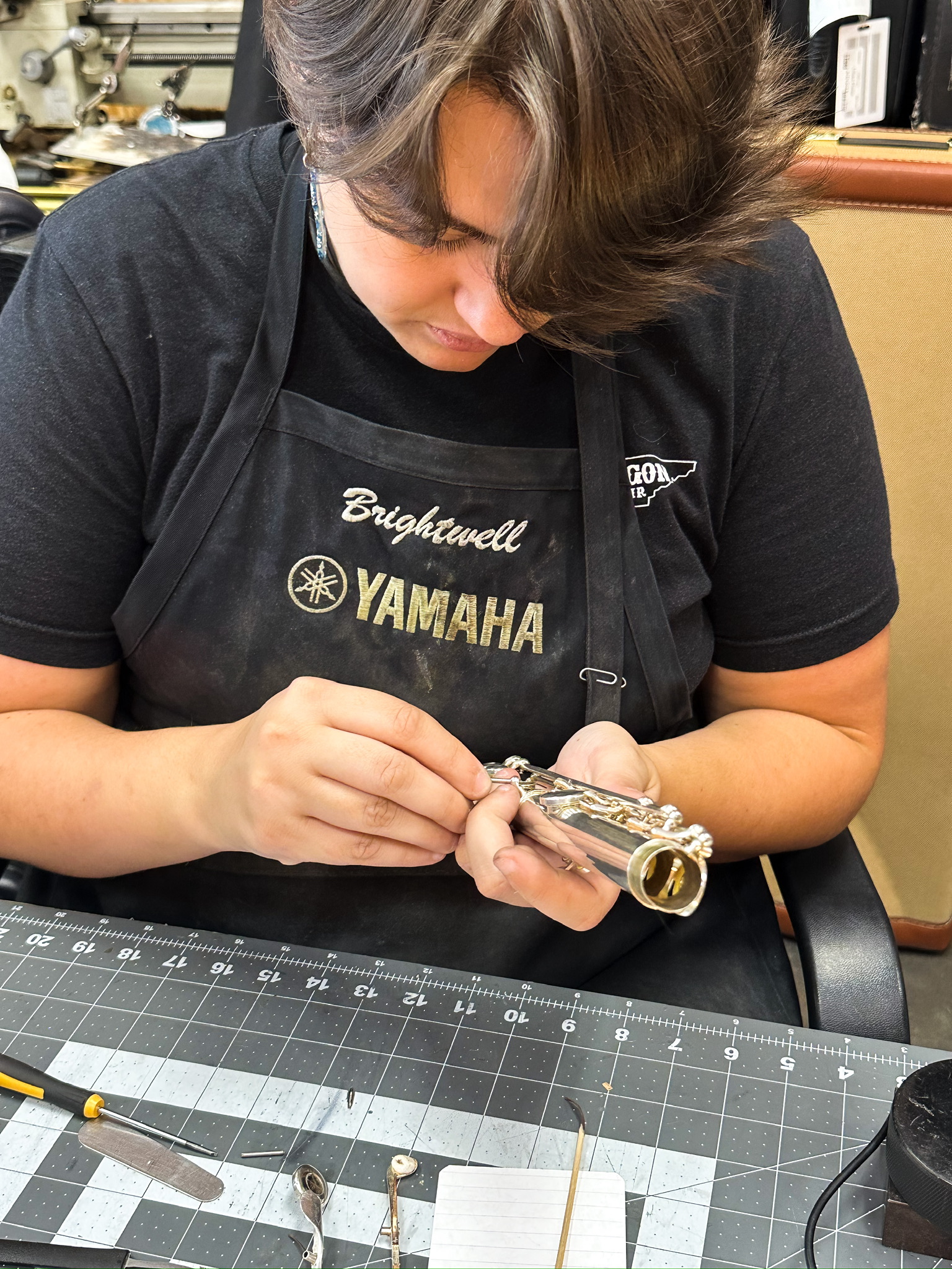 Caroline Brightwell making a repair