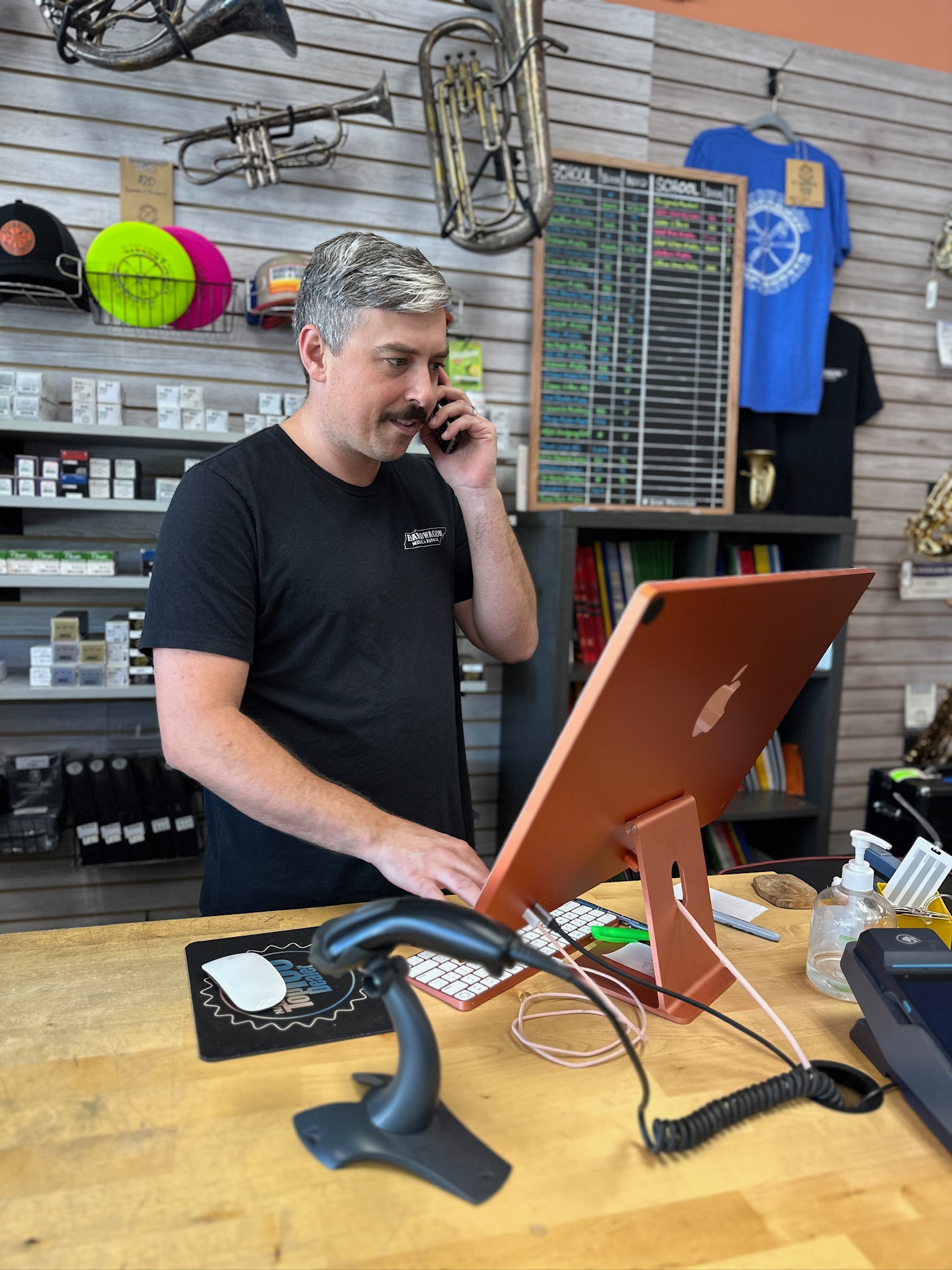 Tim Sly taking a phone call