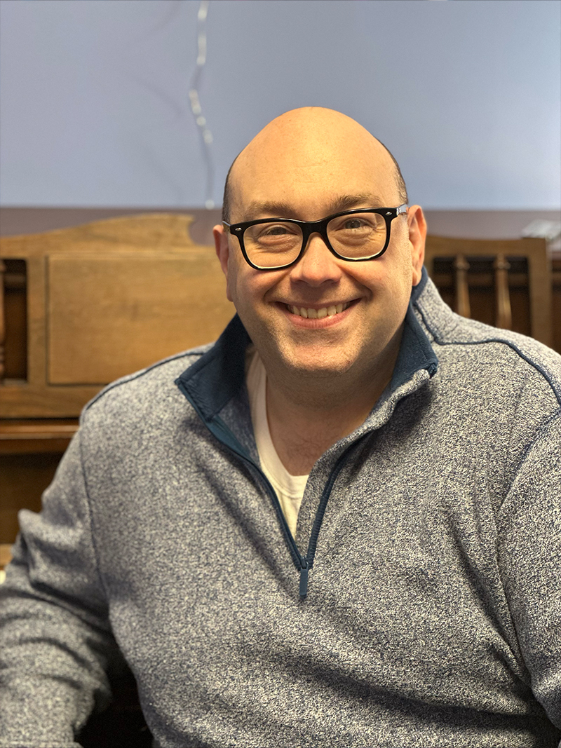 Dan in a grey sweater